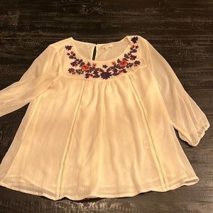 Off white blouse with flowers on neck